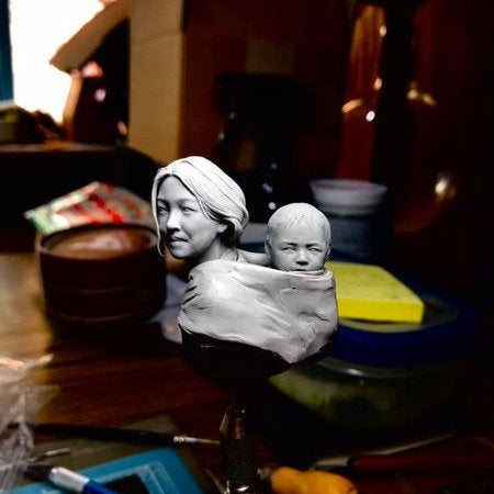 Motherhood mom and son in traditional Tibetan clothes resin model