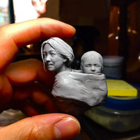 Motherhood mom and son in traditional Tibetan clothes resin model